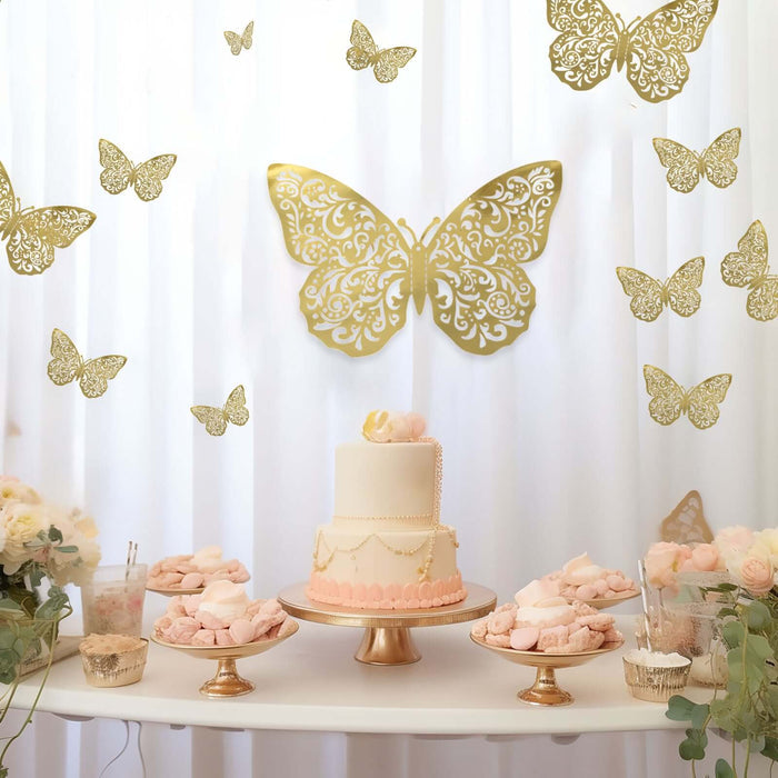 Elegant butterfly-themed cake display with gold accents and floral decorations.