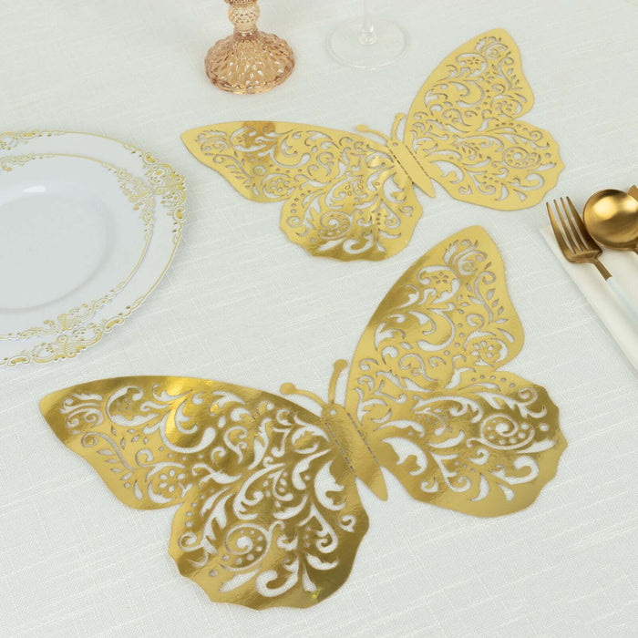 Gold butterfly table placemats on a textured white tablecloth
