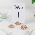 Table number card with decorative gem accents for event decoration.