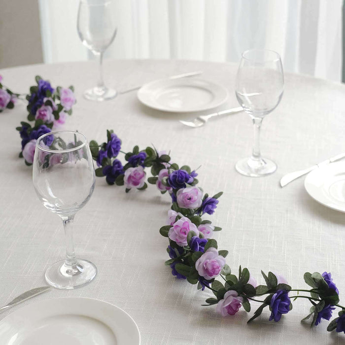 Table setting with floral garland and glassware for an elegant dining experience.