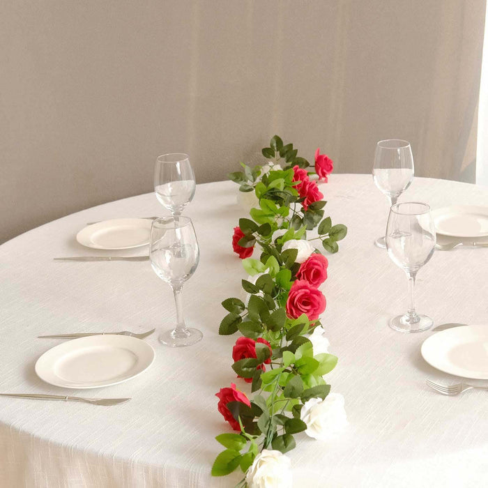 Elegant table setting with roses and glassware for a special occasion.