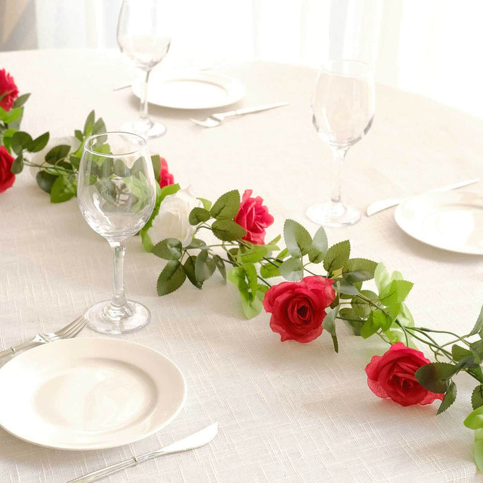 Table setting with roses, glasses, and plates for a romantic dining experience.