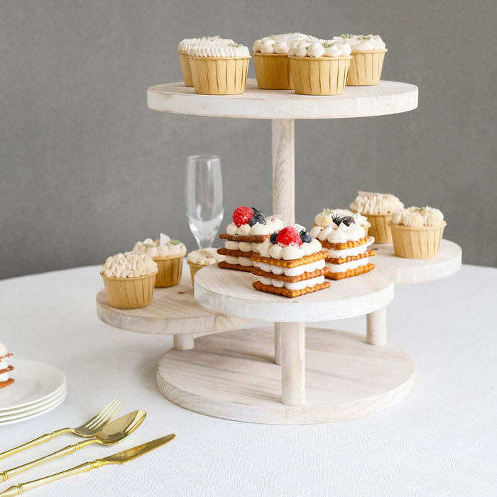 Three-tiered dessert stand with assorted cupcakes and cookies.