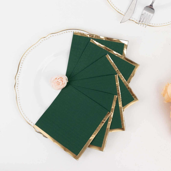 Green and gold bordered greeting cards arranged on a decorative plate.