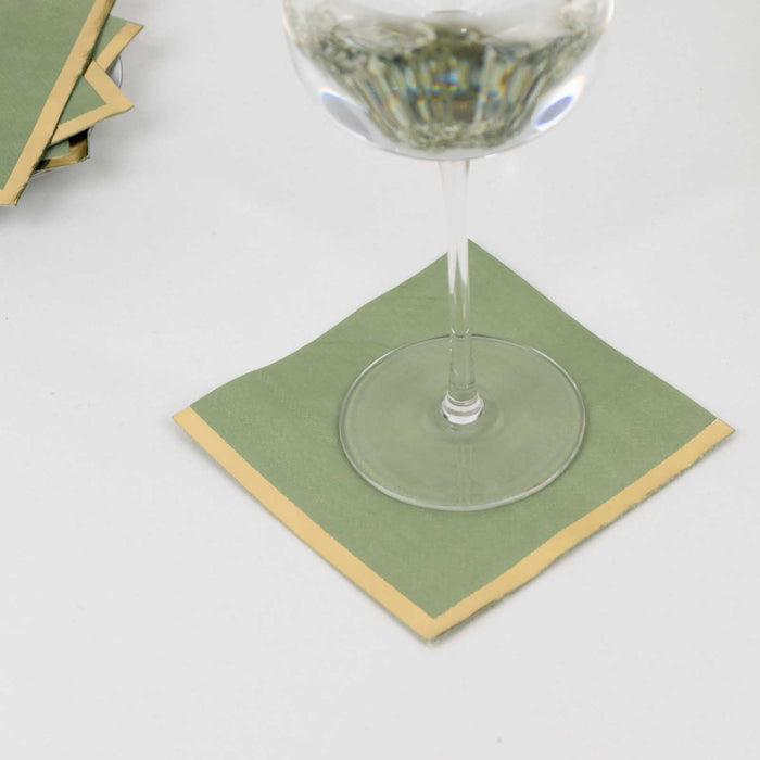 Green coasters with gold trim for drinks.