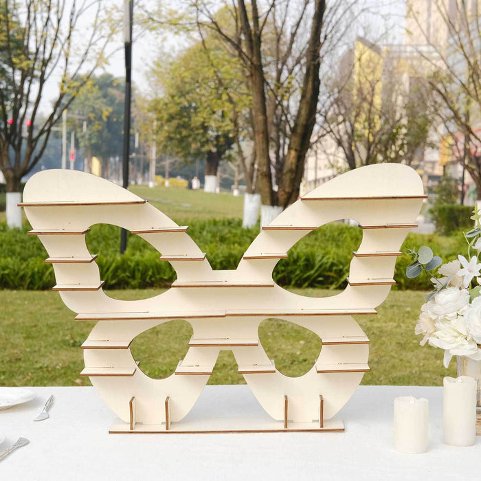 Wooden butterfly decoration for outdoor events and displays.