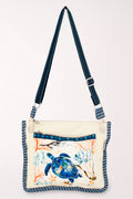 Handbag with a turtle on the front pocket