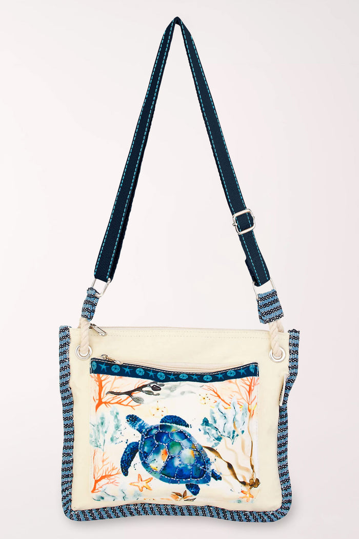 Handbag with a turtle on the front pocket