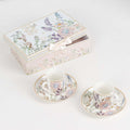 Floral porcelain tea set with matching cups and saucers in a decorative box.