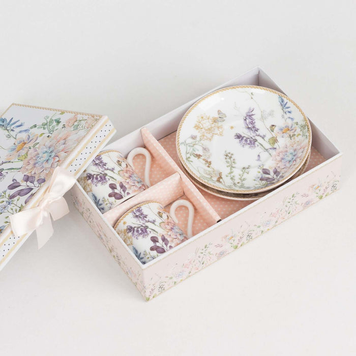Floral porcelain tea set in a gift box with two cups and a plate.