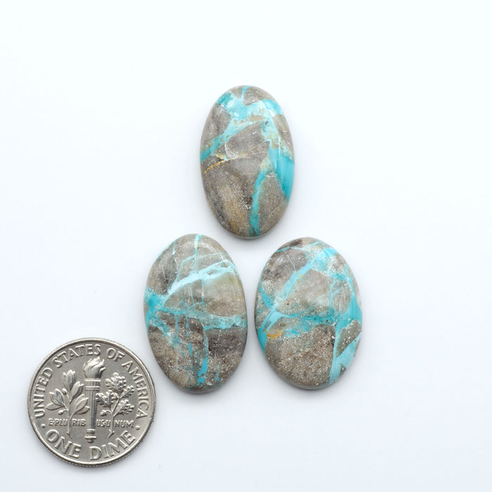 Carico Lake Turquoise cabochons with vibrant aqua-blue to turquoise tones and natural matrix, ideal for rings, pendants, and artisan jewelry.