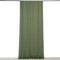 Olive green curtain draped on a rod, showcasing smooth fabric texture.