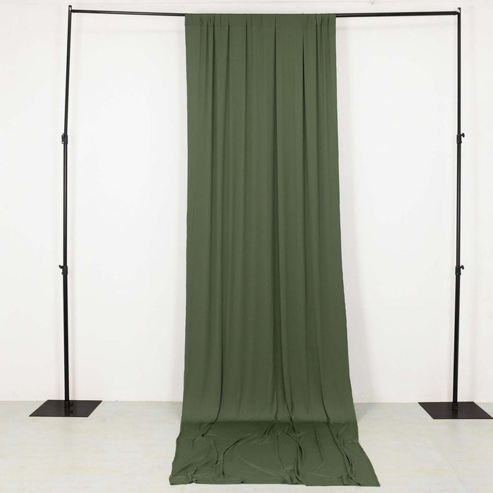 Olive green fabric draped on a black backdrop stand
