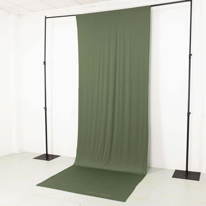 Olive green backdrop fabric on a support stand for photography