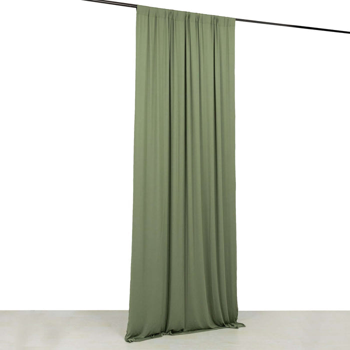 Olive green fabric curtain hanging from a rod