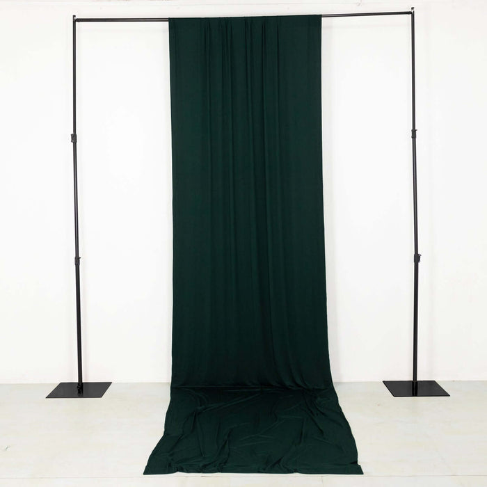 Green fabric backdrop on a stand for photography or events