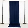 Navy blue fabric draped on a display stand against a plain background