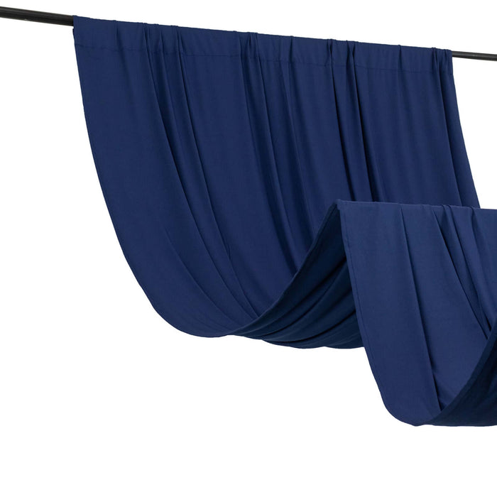 Navy blue drapery fabric hanging elegantly on a curtain rod
