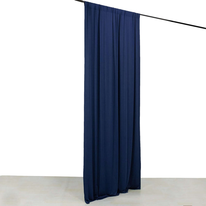 Navy blue curtain hanging from a rod against a white background