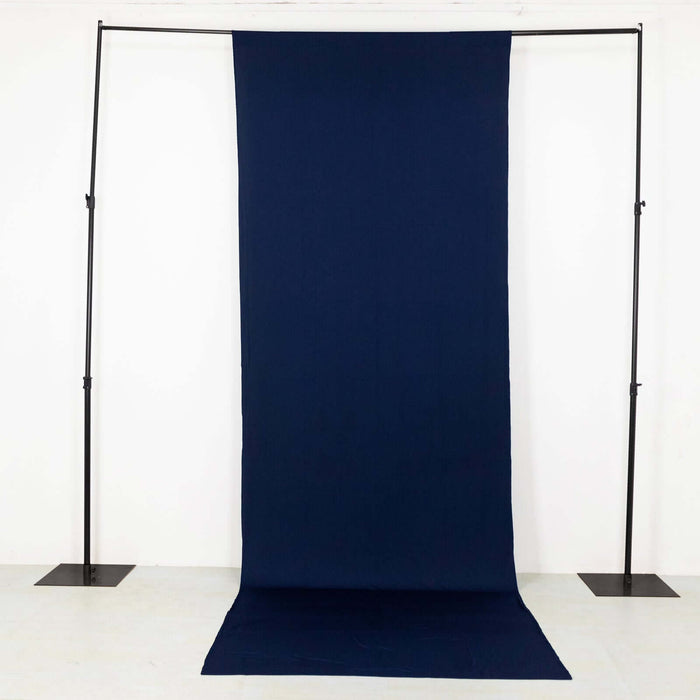 Navy fabric backdrop on a studio stand for photography