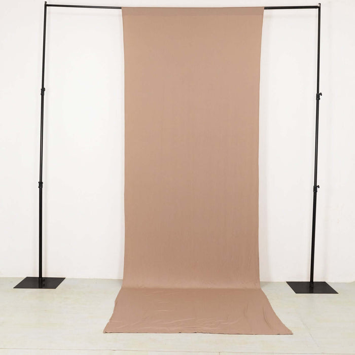 Neutral beige backdrop fabric on studio stand
