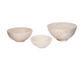 A set of three beige paper maché bowls in different sizes placed against a white background.