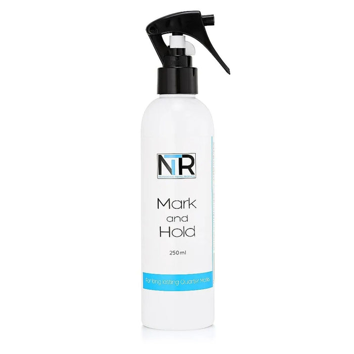 Bottle of mark and hold with small black spray nose.