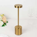 Gold modern table lamp with cylindrical base and round top.