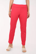 Red pants worn by a person on a white background