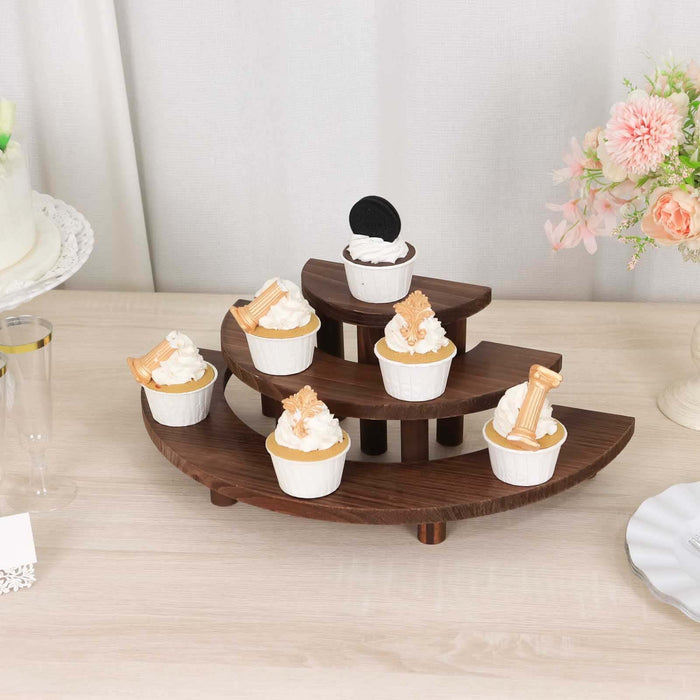 Wooden cupcake stand with seven decorated cupcakes displayed.