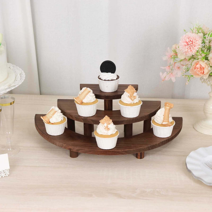 Wooden cupcake stand displaying various decorated cupcakes.