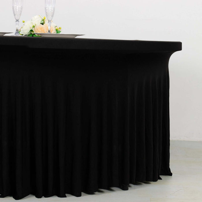 Black tablecloth with elegant pleats for event decoration.