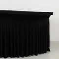 Black table with pleated skirt for events and gatherings