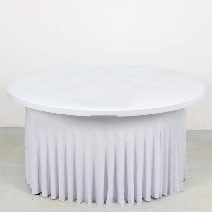 Round white table with a pleated skirt on a plain background