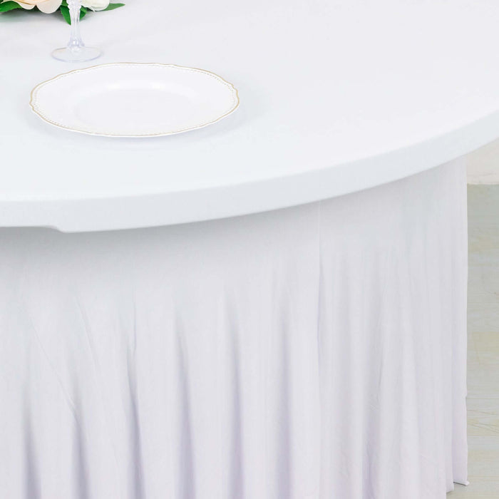 White table with elegant pleated skirt and a decorative plate on top.