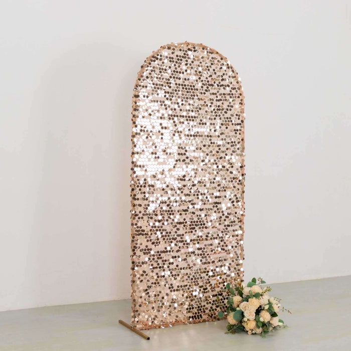 Sequin arch backdrop with floral arrangement