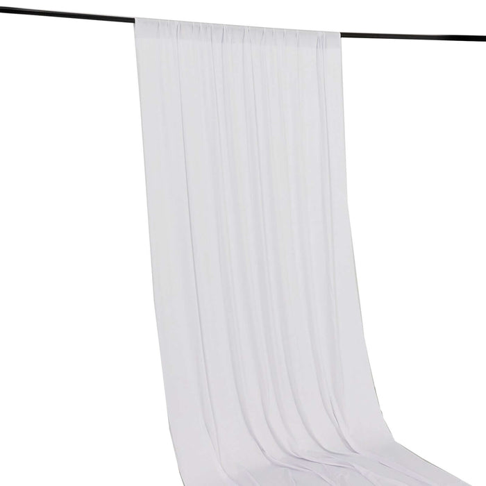 White fabric curtain draped elegantly from a black rod