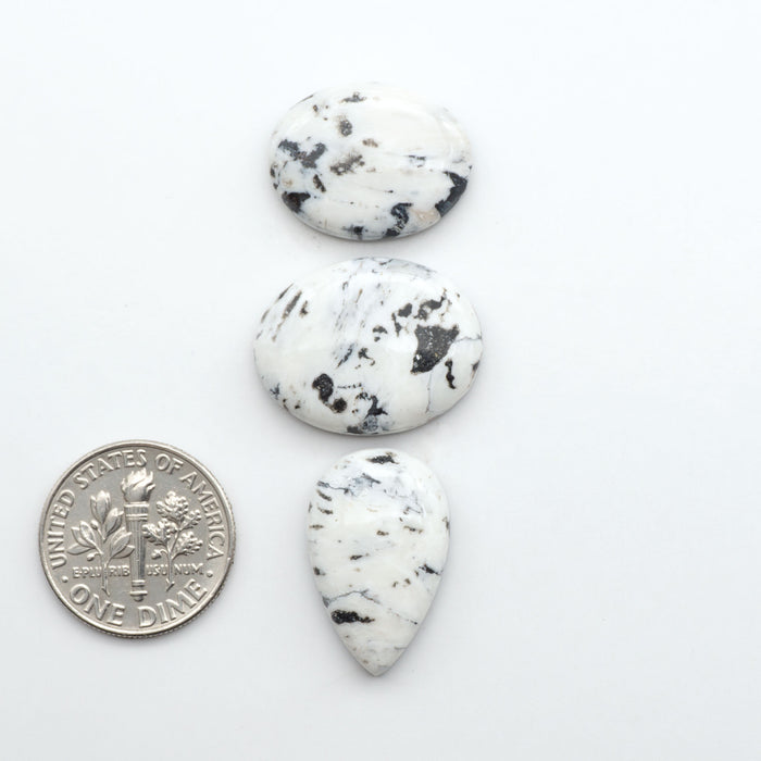 Natural White Buffalo Stone Cabochons are semi-precious gemstones cut into shapes ideal for jewelry-making, making them an excellent choice for artisans.