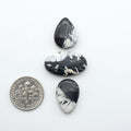 Natural White Buffalo Stone Cabochons are semi-precious gemstones cut into shapes ideal for jewelry-making, making them an excellent choice for artisans.